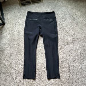 Athleta black ankle length pant with cute zip details on front